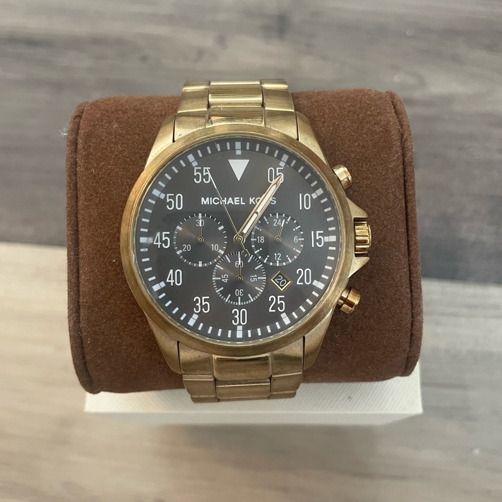 Gold MK watch.